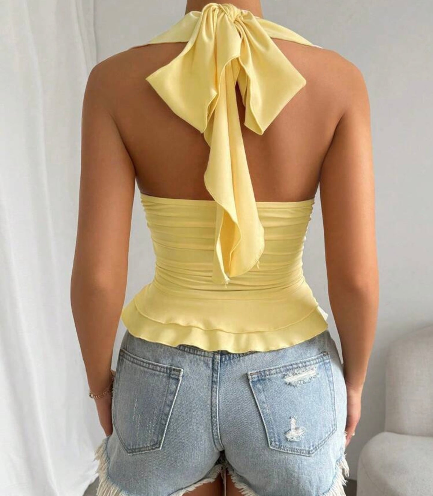 Ruffled Sleeveless Top With V-neckline